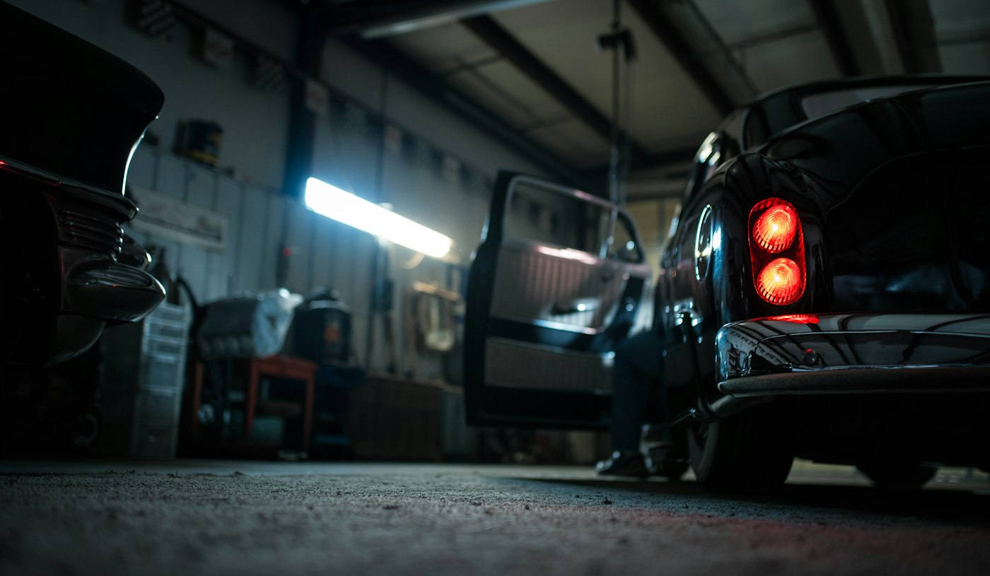 Vehicles inside a dim service garage